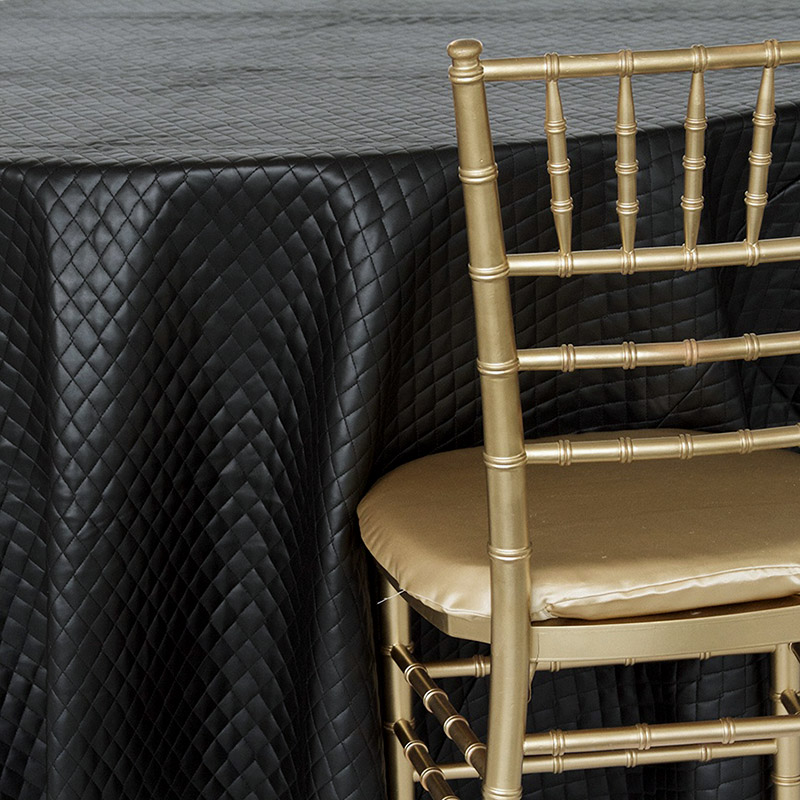 https://nuagedesigns.com/wp-content/uploads/2015/04/black-quilted-leather-linen-chair.jpg